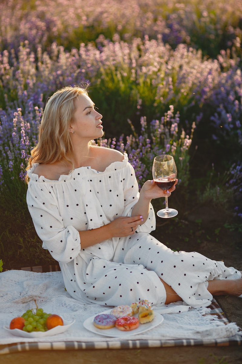 Photo by Gustavo Fring Beautiful Woman Drinking Wine on Lavender Field