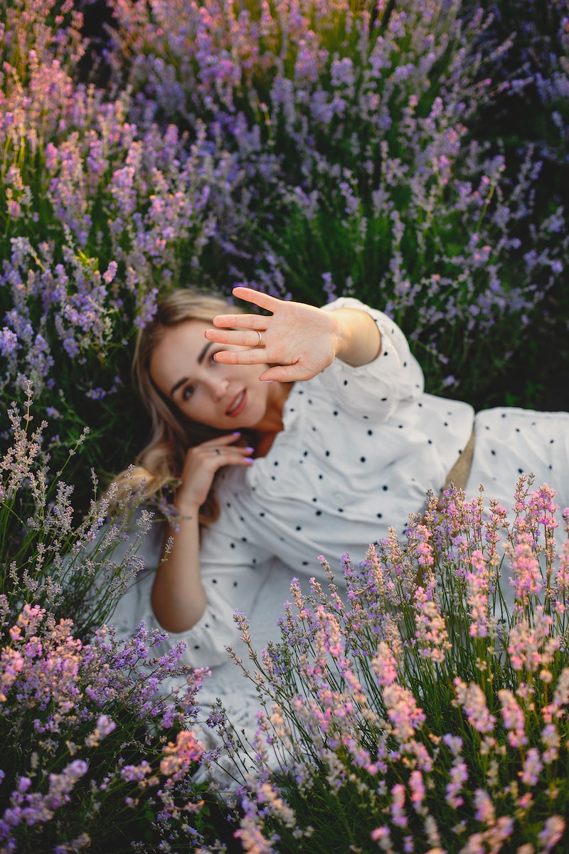 Photo by Gustavo Fring Woman Lying in Lavender Field